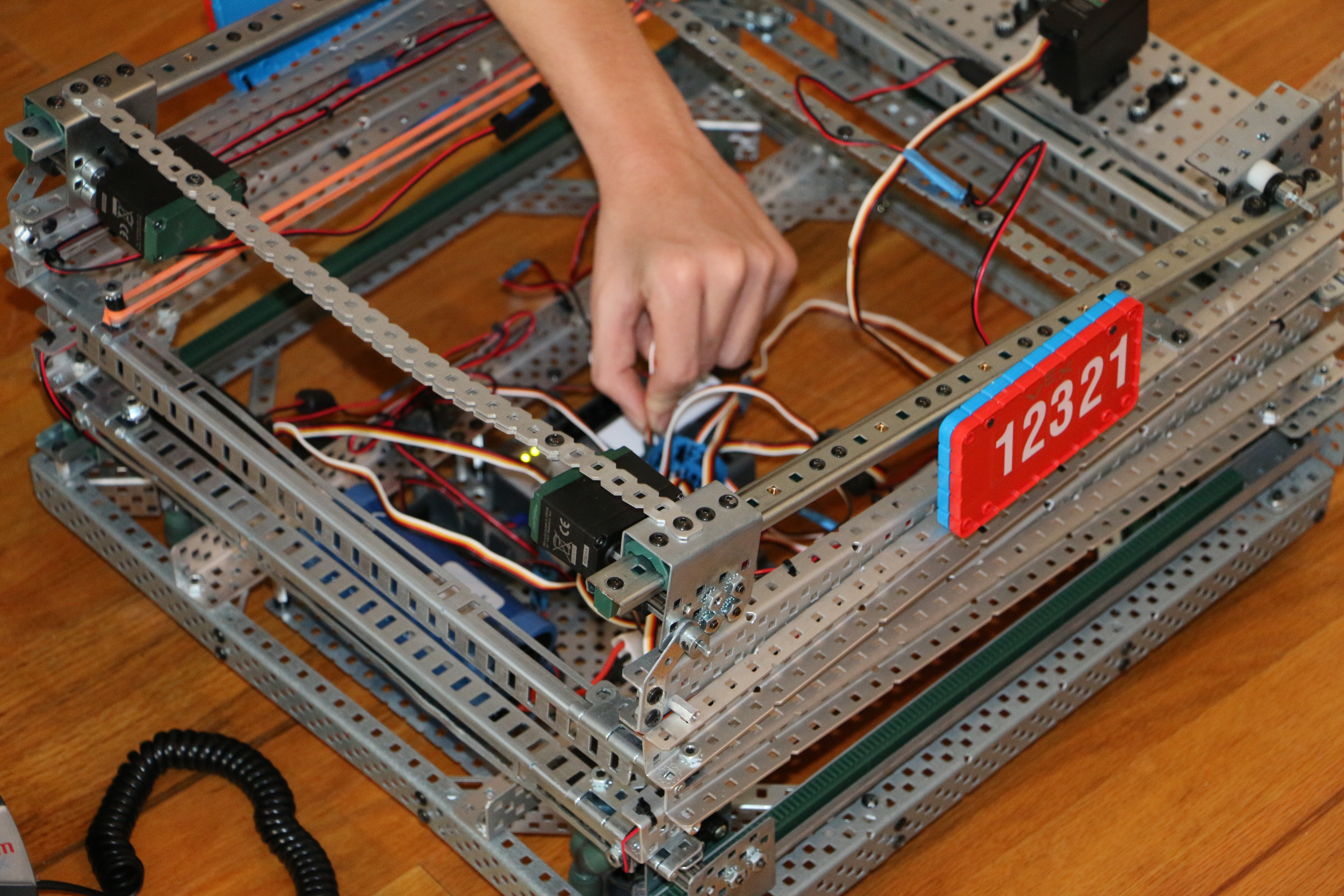Rewiring Holonomic Drive 4 Hard at work rewiring and recoding to get the encoders to work on the holonomic drive system.